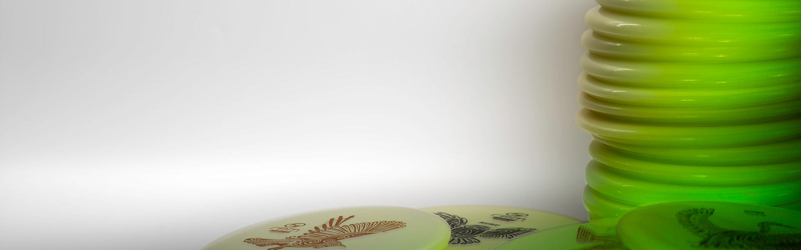 A stack of disc golf glow discs