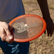 RPM Discs Piwakawaka in Cosmic being held ready to throw